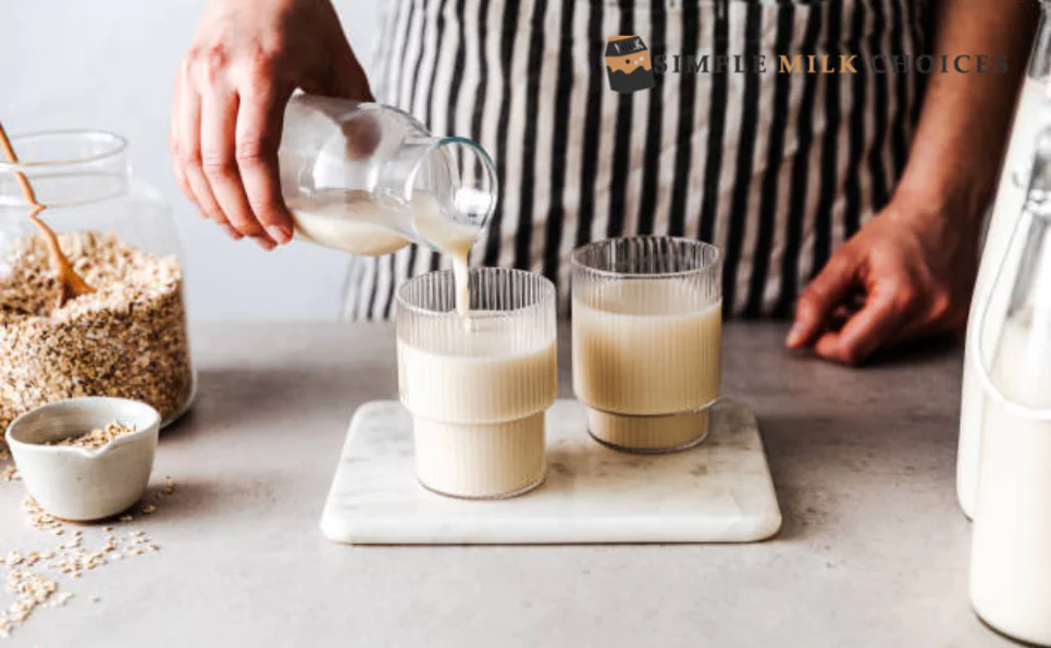A man holds two glasses side by side, one filled with skim milk and the other with almond milk. He carefully examines the differences in color and texture, contemplating the choice between traditional dairy and plant-based alternatives.