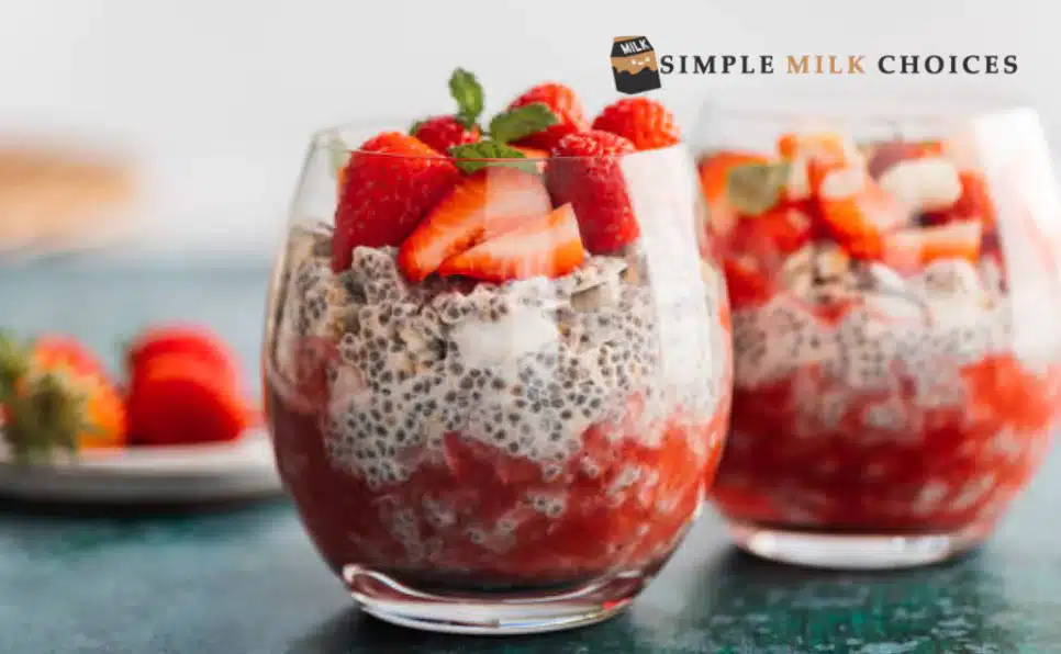 Pudding made with almond milk topped with assorted fruits and a fresh strawberry on a plate.