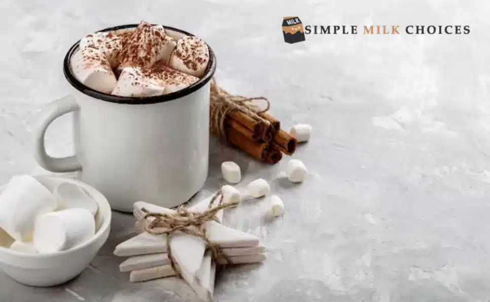 Steaming cup of indulgent hot chocolate made with creamy almond milk, topped with frothy foam and chocolate shavings.