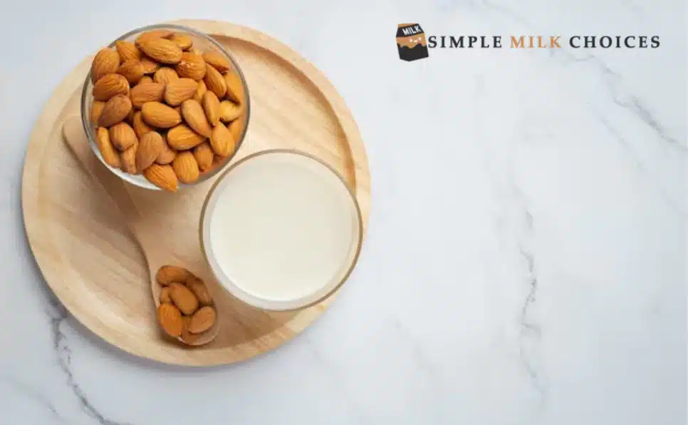 Glass of almond milk next to a bowl of almonds, highlighting gluten-free, natural alternative in a dietary concept.
